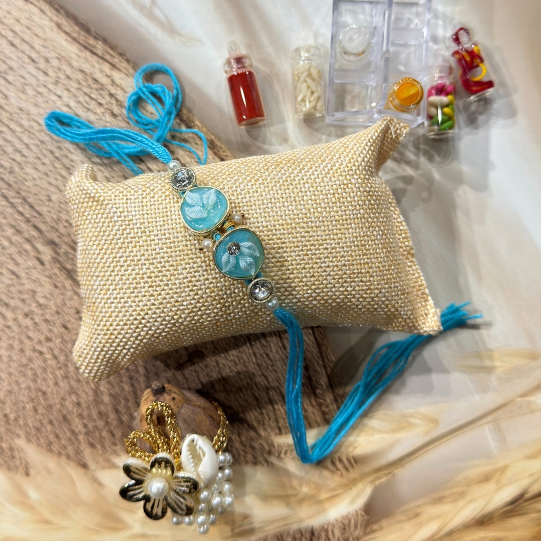 84 Aqua Bloom Rakhi Hamper Set - Image 1